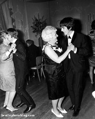 George Harrison and Ringo Starr dancing with their mothers.
