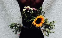 Black Men With Flowers by Berlin-based Nigerian photographer Lynette Luna
