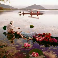 Kashmir, India, November 1956 floating with flowers norman parkinson