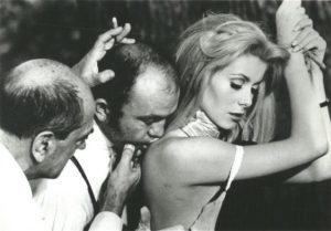 Luis Bunuel, Michel Charrel and Catherine Deneuve on the set of Belle de jour, 1967