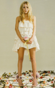 Mary-Kate poses in a white strapless ruffle dress and chiffon flower sandals for You magazine, 2007
